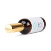 Kenzul Atlas Argan Oil bottle lying on its side, gold cap