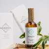 Kenzul Atlas Argan Oil bottle and box on a wood slice with argan leaves